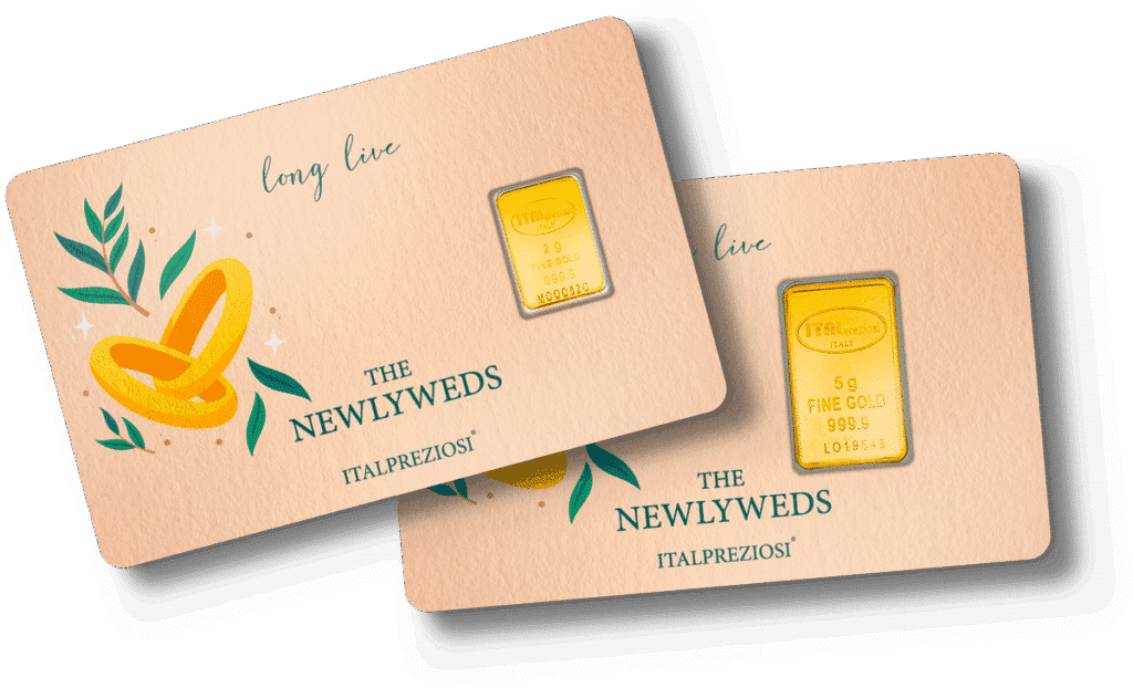 Two beige Wedding cards with gold rings and green leaves feature yellow-gold bars. Each card reads "long live THE NEWLYWEDS ITALPREZIOSI" and displays a fine gold bar—one 1g, the other 5g.
