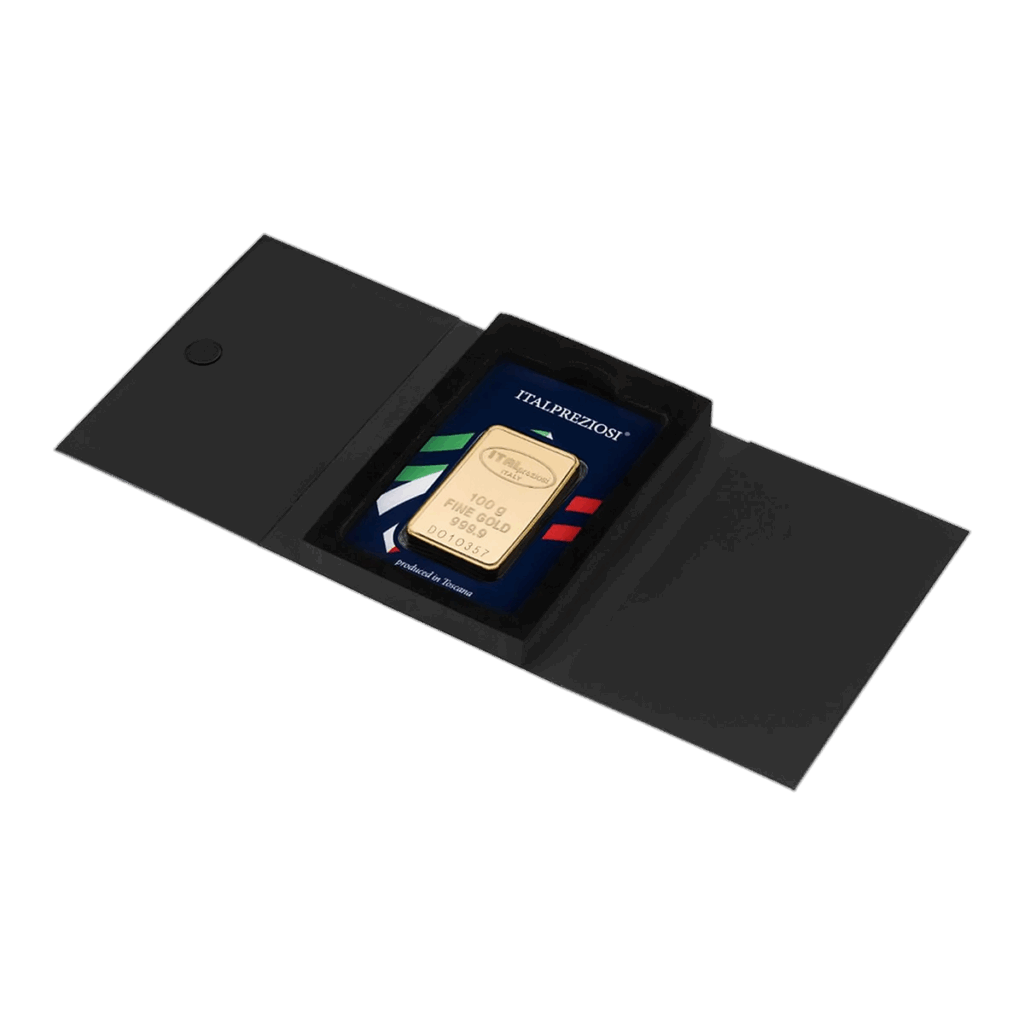 Il Lingotto Oro 100gr è presentato in un astuccio nero aperto con dietro un cartoncino a righe tricolori e la scritta "ITALPREZIOSI" visibile sul cartoncino.