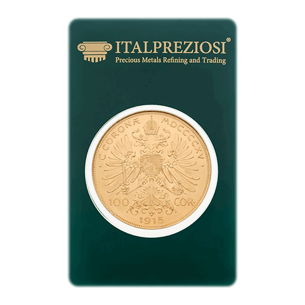 Una moneta d'oro da 100 corone d'Austria, segnata 1915, con il disegno dell'aquila bicipite, è sigillata in un cartoncino verde Italpreziosi con la dicitura Raffinazione e commercio di metalli preziosi.