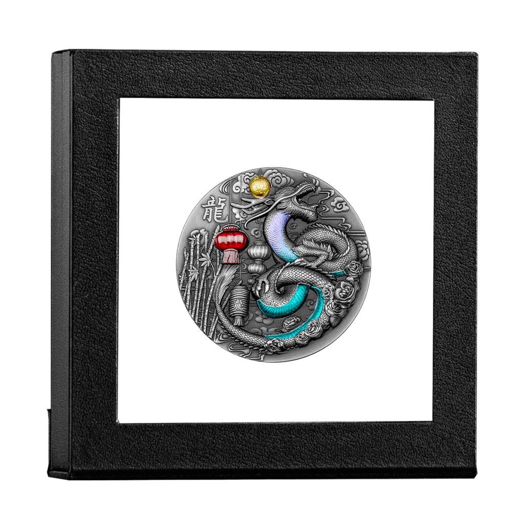 The Year of the Dragon 2024 CFA Francs silver coin features a detailed dragon with vibrant turquoise, purple, red, and gold accents, displayed upright in a black square frame.